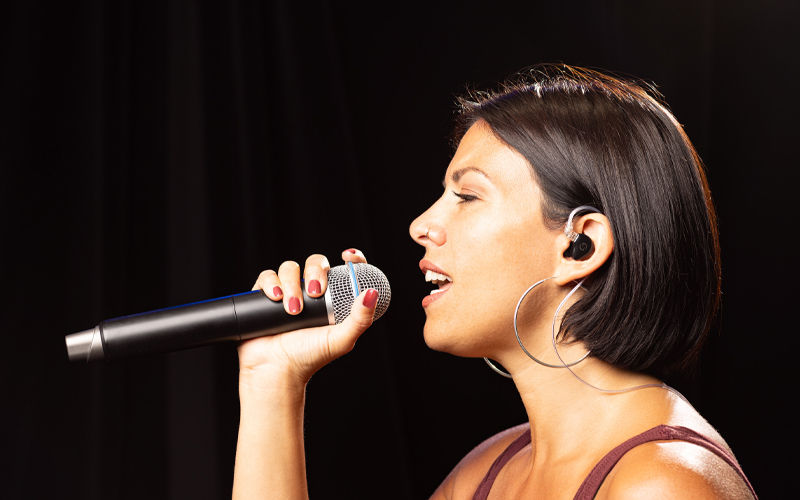 Singer with IEM Earphones and wireless mic